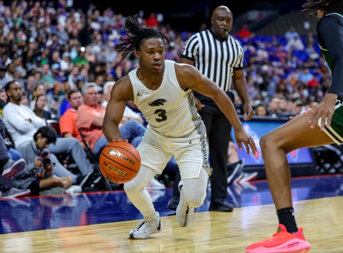 Plano East senior Isaiah Brewington dribbles against Lake Ridge in the UIL 6A state semifinals on Mar. 8, 2024.